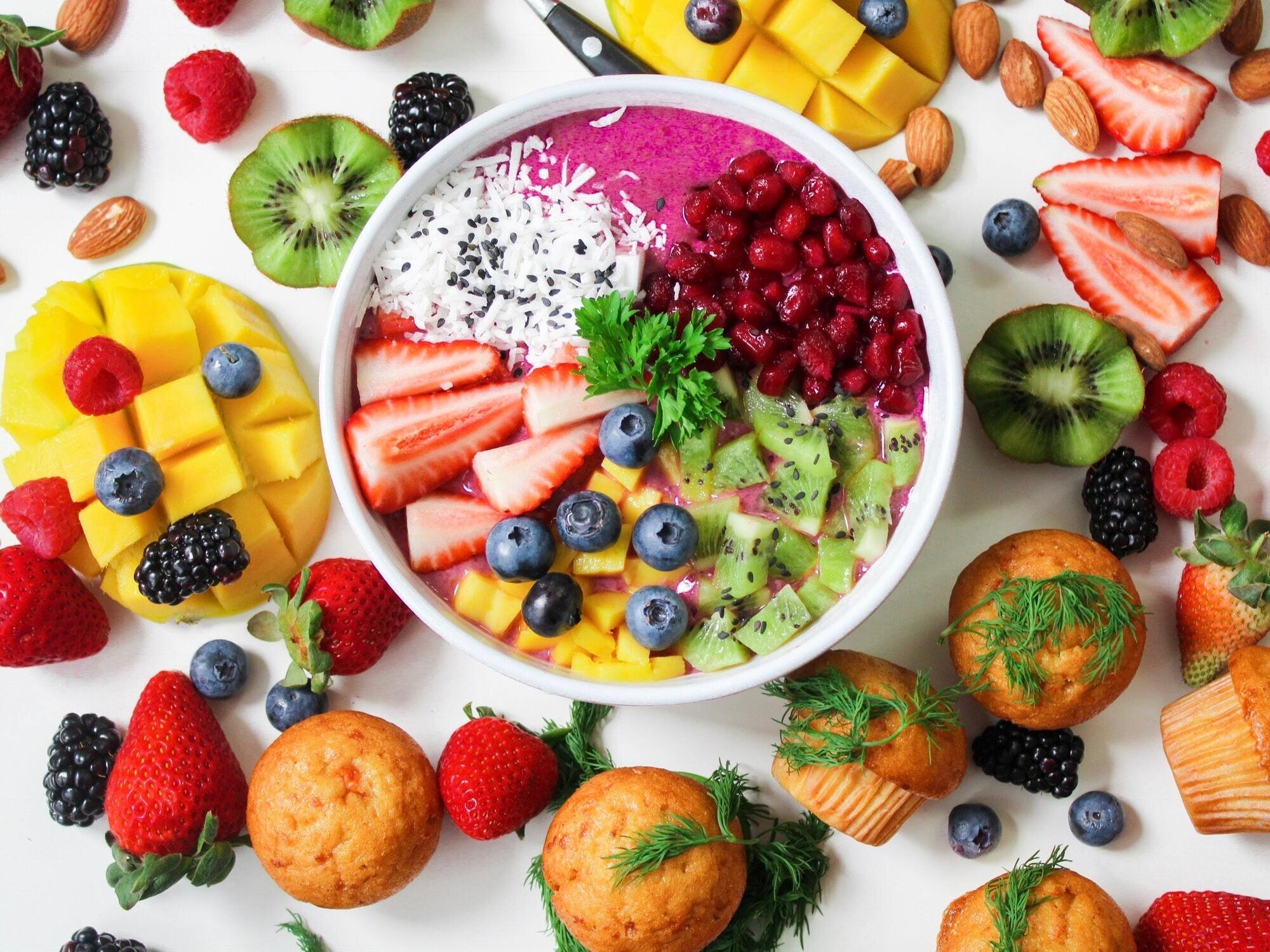 Chopped fruit and a bowl of fruit salad